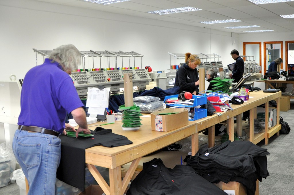 PomPrint's busy embroidery department hard at work.